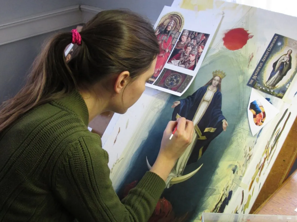Illustrator Bernadette Carstensen paints Mary, the immaculate Virgin, as the centerpiece of her triptych “St. John’s Revelation.” (Courtesy of Bernadette Carstensen)