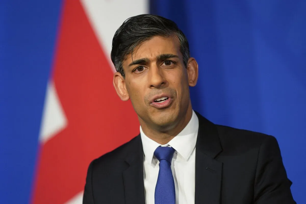 Britain's Prime Minister Rishi Sunak hosts a press conference inside the Downing Street Briefing Room after Britain and Rwanda sign a new treaty to transfer illegal immigrants to the African country, in central London, on Dec. 7, 2023. (James Manning/POOL/AFP via Getty Images)