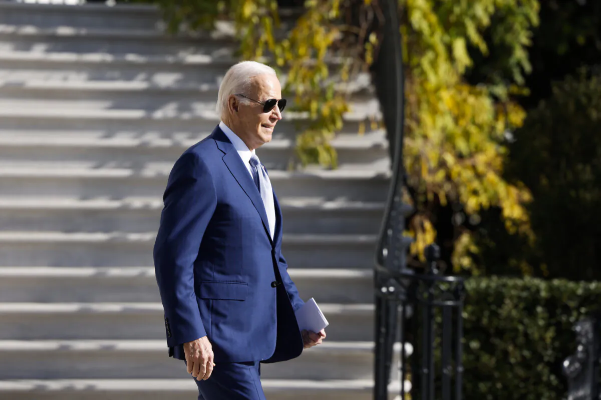 President Joe Biden walks on the South Lawn to board Marine One before departing the White House on Dec. 8, 2023. (Anna Moneymaker/Getty Images)