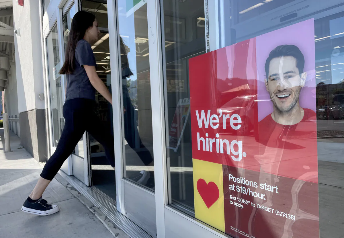 A customer walks by a now hiring sign posted in front of a Target store in Sausalito, Calif., on Nov. 3, 2023. (Justin Sullivan/Getty Images)