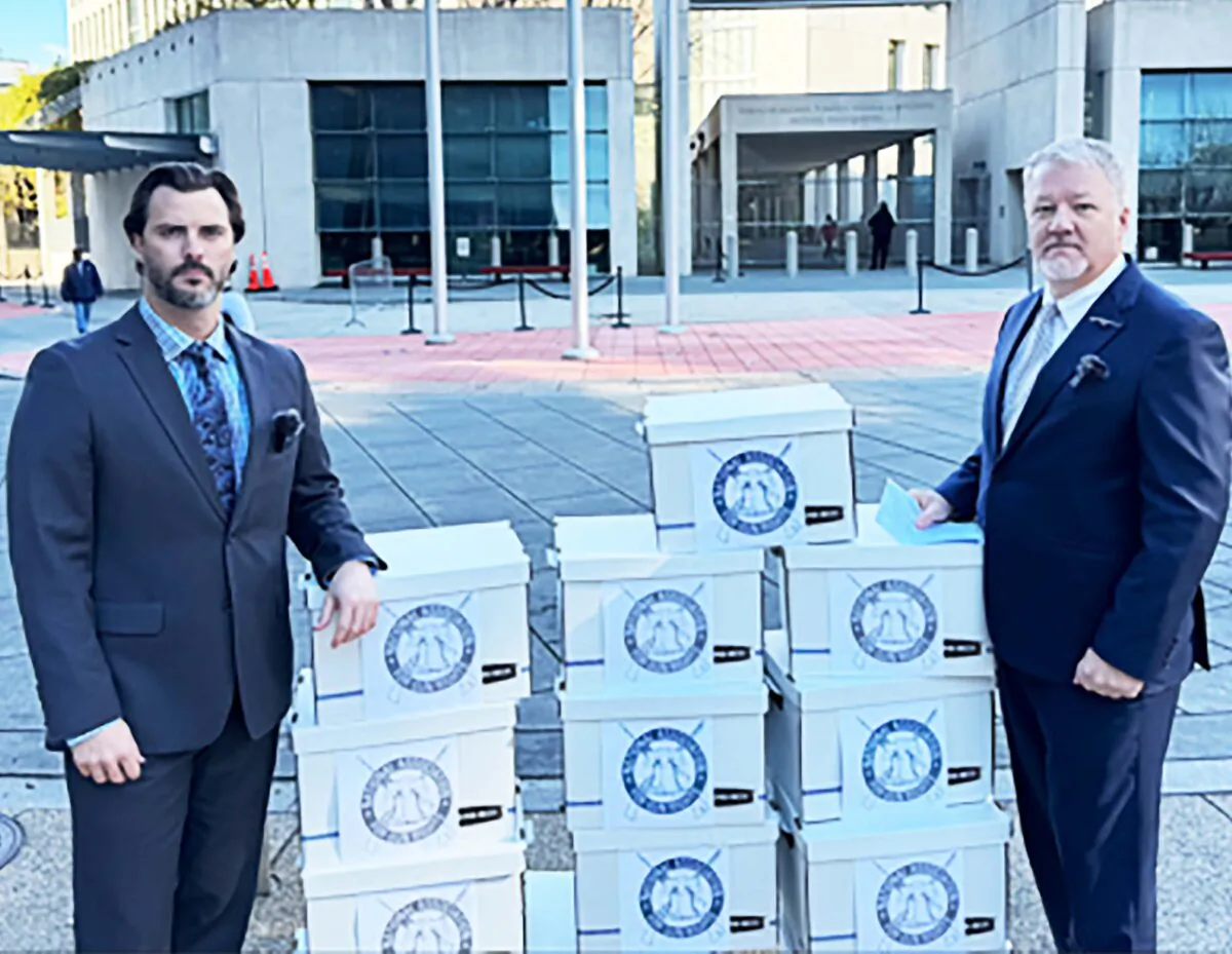 (L) Hunter King, director of Government Relations for the National Association for Gun Rights, (NAGR) and (R) NAGR president Dudley Brown attempt to deliver 40,000 petitions to the Bureau of Alcohol, Tobacco, Firearms, and Explosives on Nov. 30, 2023. (Courtesy the National Association for Gun Rights)