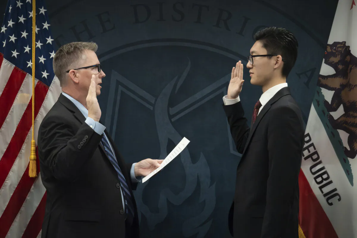 In this photo provided by the Tulare County District Attorney's Office, Peter Park (R) is sworn in by District Attorney Tim Ward in Visalia, Calif., on Dec. 5, 2023. (Tulare County District Attorney's Office via AP)