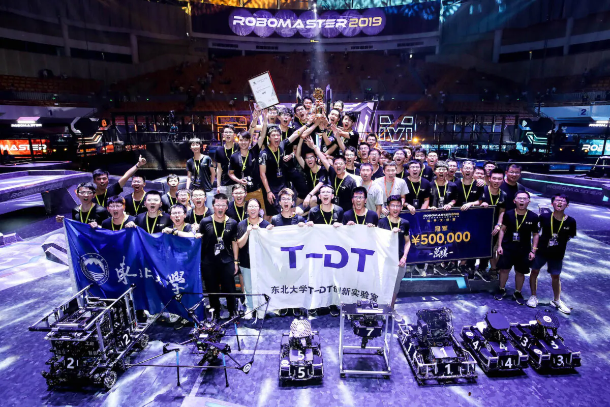 Students from T-DT Innovation Lab of Northeastern University holding the trophy celebrate after winning 2019 RoboMaster Robotics Competition Final Tournament champion match against Jiaolong of Shanghai Jiao Tong University at Bao'an Stadium in Shenzhen, Guangdong Province of China on Aug. 11, 2019. (VCG for 2019 RoboMaster Robotics Competition Final Tournament via Getty Images)