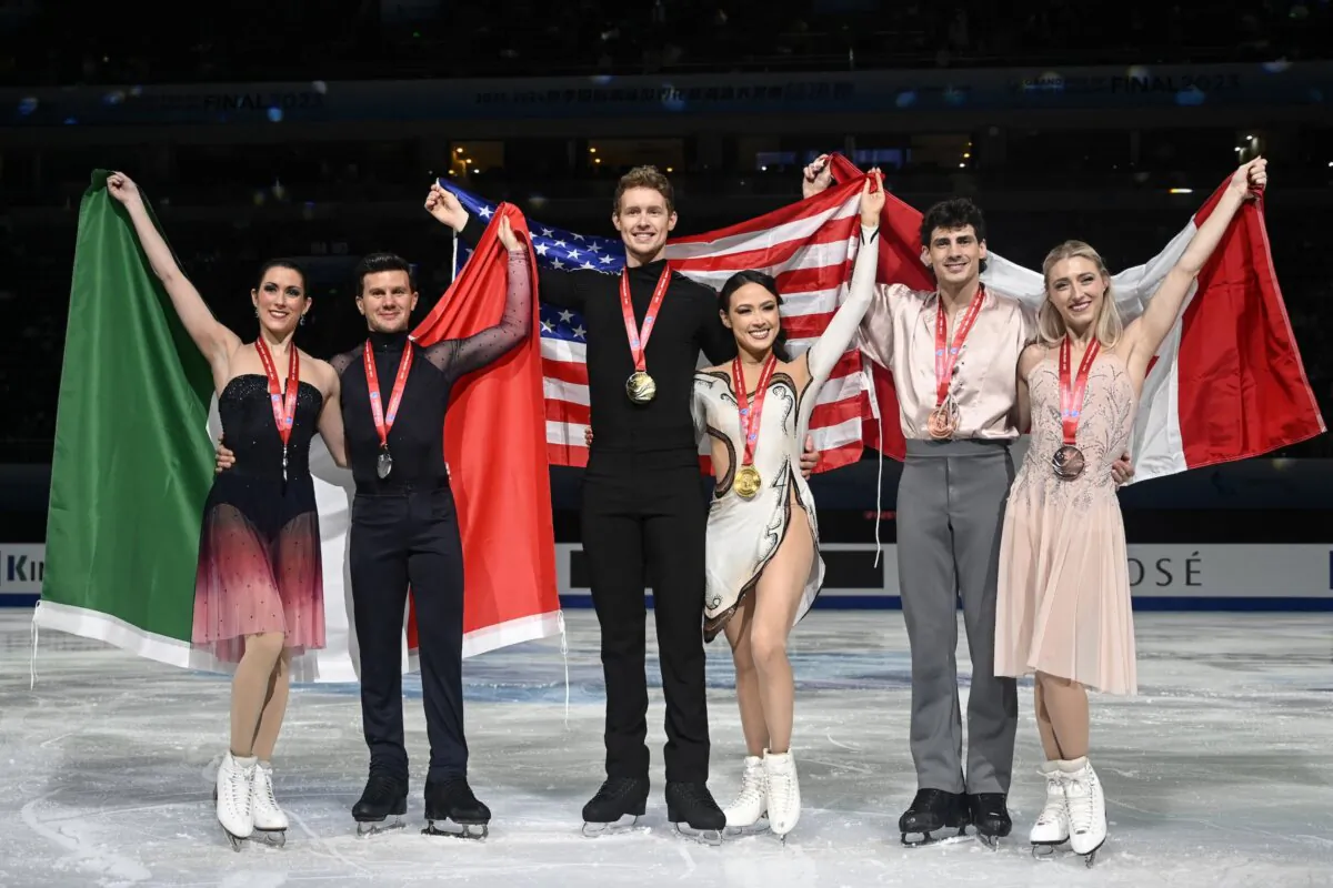 Gold medallists Madison Chock (3rd R) and Evan Bates (3rd L) of the United States, silver medallists Charlene Guignard (L) and Marco Fabbri (2L) of Italy, and bronze medallists Canada's Piper Gilles (R) and Paul Poirier of Canada pose with their country's national flag during the medal ceremony for ice dance free skating event during the ISU Grand Prix of Figure Skating Final in Beijing on Dec. 9, 2023. (Wang Zhao/AFP via Getty Images)