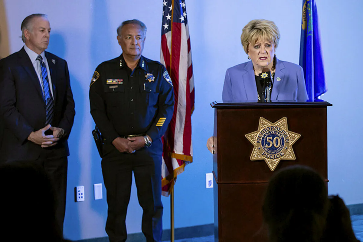 Las Vegas Mayor Carolyn Goodman (R) speaks about a fatal shooting on the University of Nevada, Las Vegas, campus during a news conference at Las Vegas Metropolitan Police headquarters in Las Vegas on Dec 6, 2023. Listening is Nevada Gov. Joe Lombardo (L) and Adam Garcia, vice president of public services and director of UNLV Police. (Christopher DeVargas/Las Vegas Sun via AP)