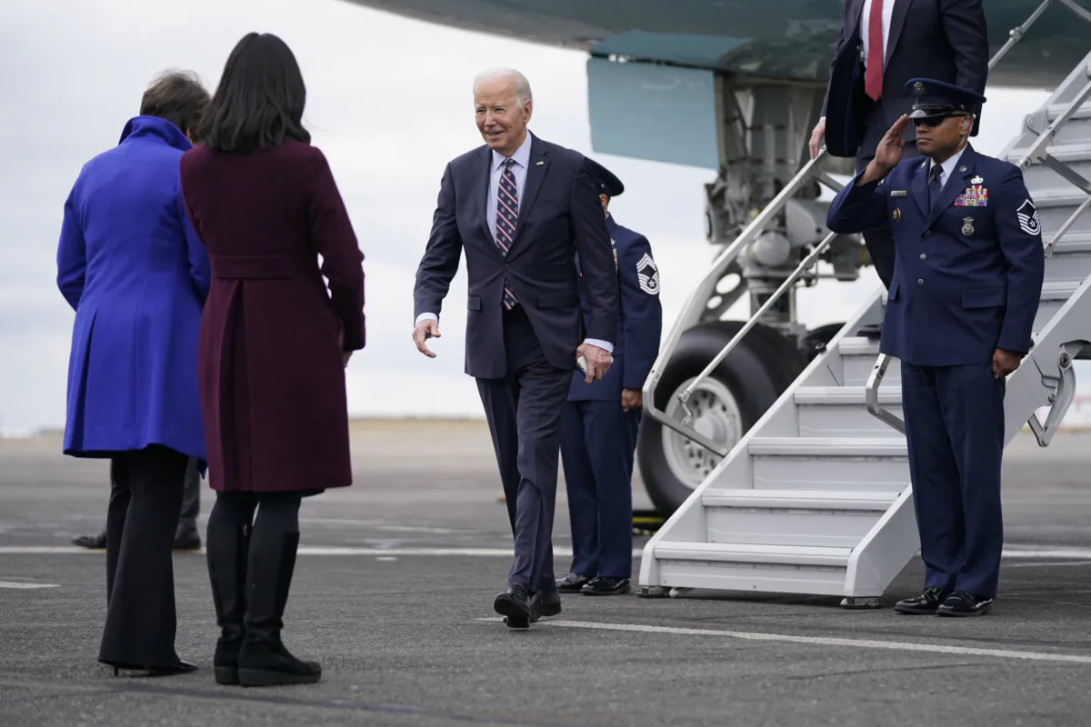 President Joe Biden walks to greet Massachusetts Gov. Maura Healey, left, and Boston Mayor Michelle Wu as he arrives at Boston Logan International Airport to attend several campaign fundraisers, Tuesday, Dec. 5, 2023, in Boston. With an election year around the corner, Biden is accelerating his fundraising to prepare for an astronomically expensive campaign. (AP Photo/Evan Vucci, File)