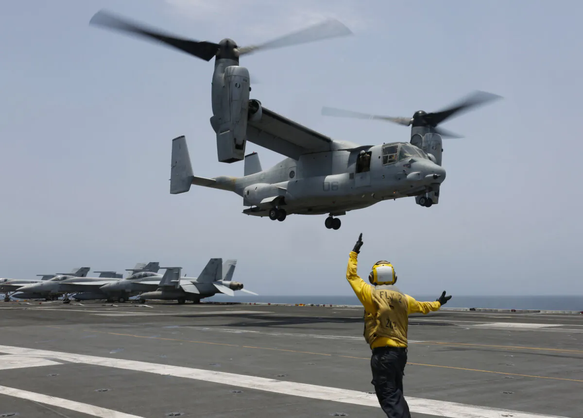 An MV-22 Osprey prepares to land on the flight deck of the USS Abraham Lincoln in the Arabian Sea on May 17, 2019. (Mass Communication Specialist 3rd Class Amber Smalley/U.S. Navy via AP)