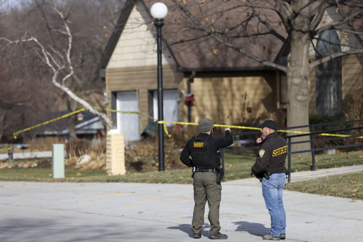The Washington County Sheriff's office investigates the scene of a fatal stabbing on a Catholic priest in the rectory of St. John the Baptist Church in Fort Calhoun, Neb., on Dec. 10, 2023. (Nikos Frazier/Omaha World-Herald via AP)