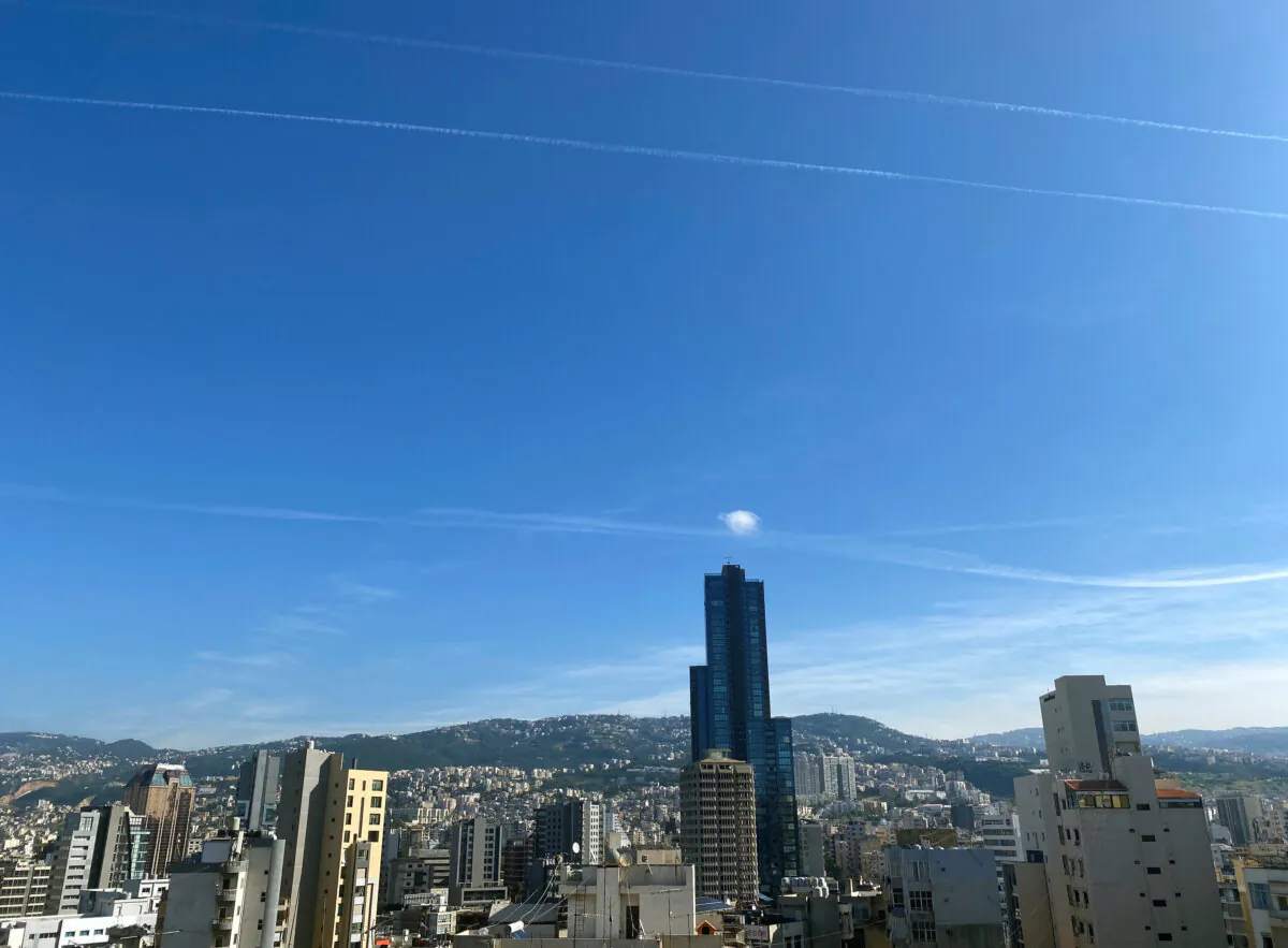 Aircraft leave vapour trails in the sky above Beirut, Lebanon, on Dec. 10, 2023. (Cynthia Karam/Reuters)
