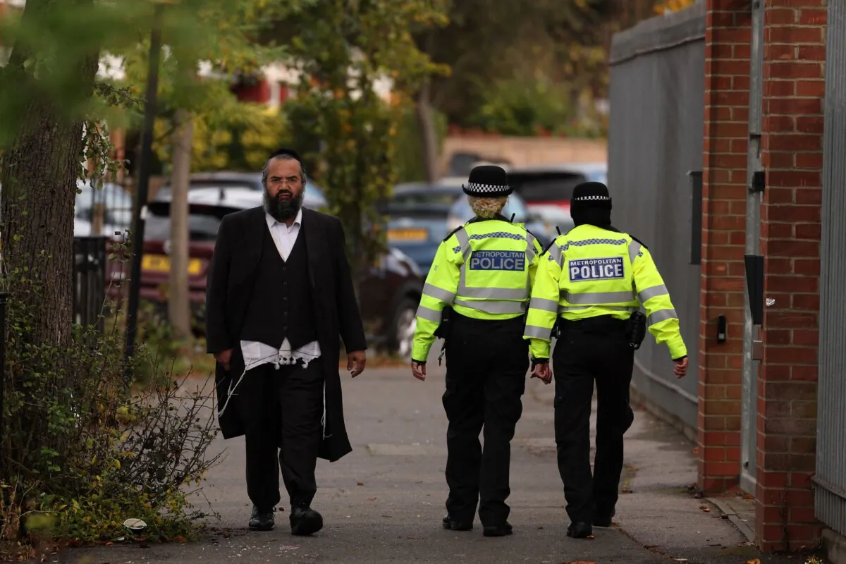 Metropolitan police officers are seen patrolling the ultra-Orthodox Jewish communities in Stamford Hill, north London on Oct. 13, 2023. (Daniel Leal/AFP via Getty Images)