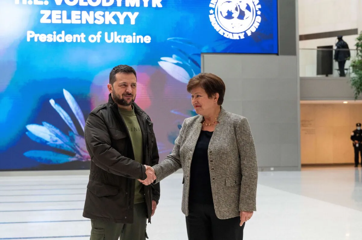 Ukrainian President Volodymyr Zelenskyy and International Monetary Fund (IMF) Director Kristalina Georgieva (R) shake hands at the IMF prior to a meeting in Washington on Dec. 11, 2023. (Roberto Schmidt/AFP via Getty Images)
