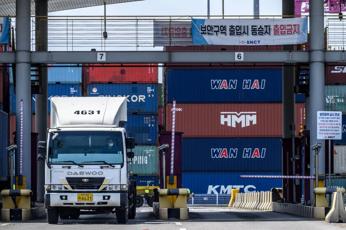 A South Korean truck driver who is not on strike leaves a container port in Incheon on June 14, 2022, on the eighth day of protests over rising fuel costs that have further snarled global supply chains. (Anthony Wallace/ AFP via Getty Images)