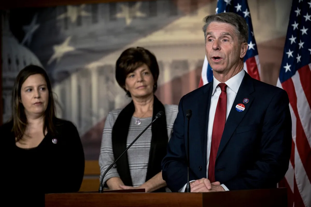 Republican Conference Chair Elise Stefanik and Rep. Yvette Herrell (R-N.M.) look on as Rep. Rob Wittman (R-Va.) speaks at a press conference on Capitol Hill in Washington on Nov. 2, 2021. (Pete Marovich/Getty Images)