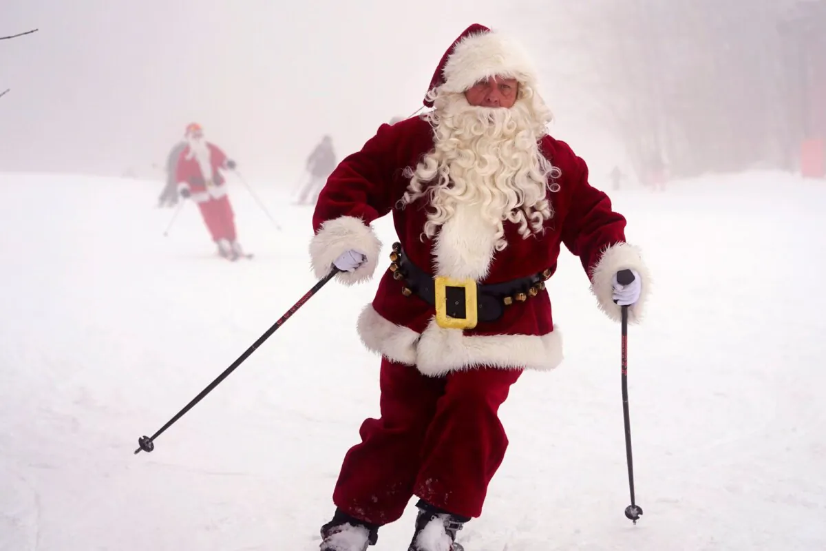 Skiers dressed as Santa Claus ski at the Sunday River ski resort in Newry, Maine, on Dec. 10, 2023. (Robert F. Bukaty/AP Photo)