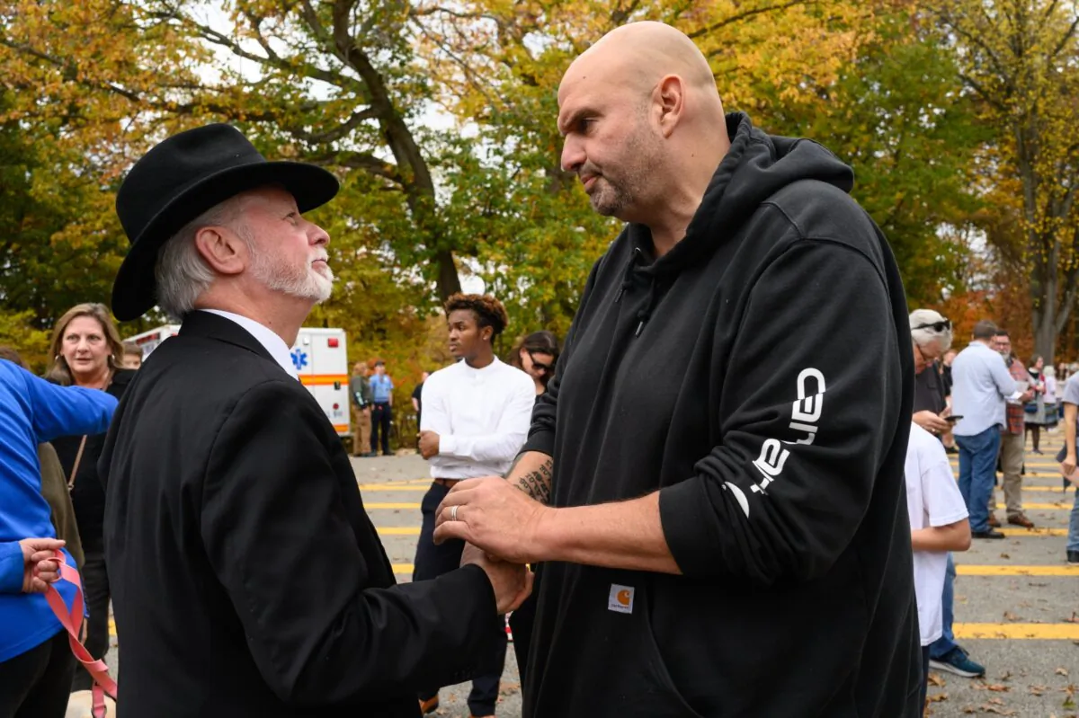 Rabbi Jeffrey Myers of the Tree of Life synagogue greets Pennsylvania Senator John Fetterman at the Commemoration Ceremony on the fifth anniversary of the Tree of Life synagogue attack, in Pittsburgh, Pa., on on Oct. 27, 2023. The shooting, the deadliest attack on Jews in U.S. history, left 11 dead after a gunman stormed a synagogue in Pittsburgh's Squirrel Hill neighborhood. (Justin Merriman/Getty Images)