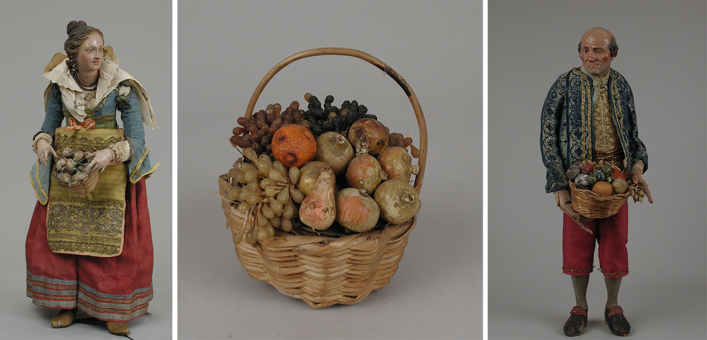 creche figurines of townspeople with baskets of fruits and vegetables