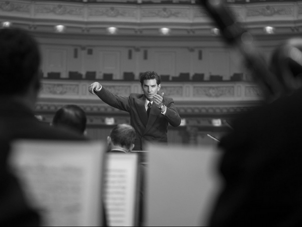man conducting orchestra in MAESTRO