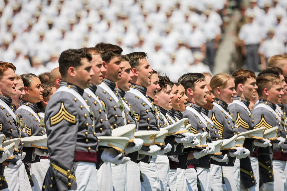 West Point graduates stand and sing the Army Song during the 2022 West Point Commencement Ceremony at West Point Military Academy in West Point, N.Y., on May 21, 2022. (Michael M. Santiago/Getty Images)
