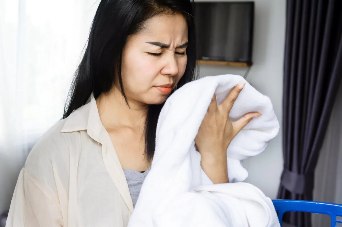 Smelly towels are a result of too much product buildup. (Doucefleur/Shutterstock)