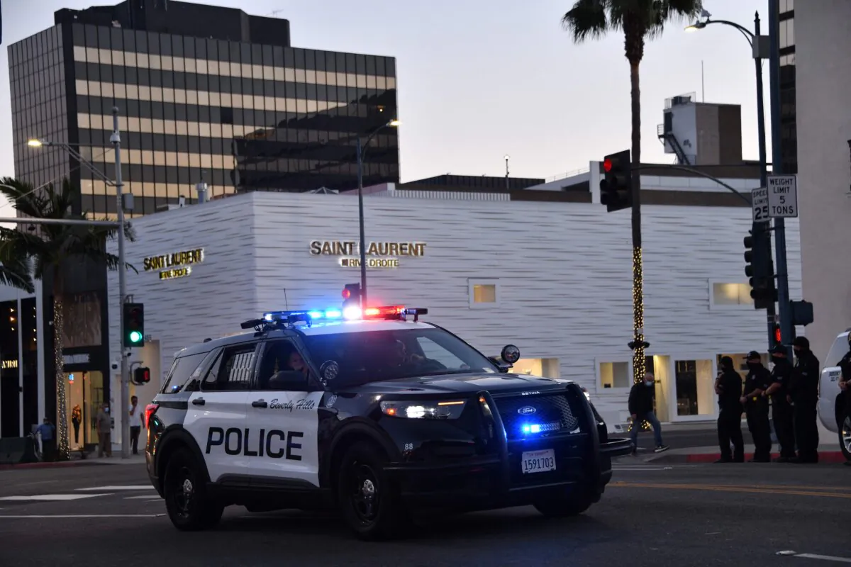 Beverly Hills police officers patrol in their car in Beverly Hills, Calif., on Nov. 1, 2020. (Chris Delmas/AFP via Getty Images)