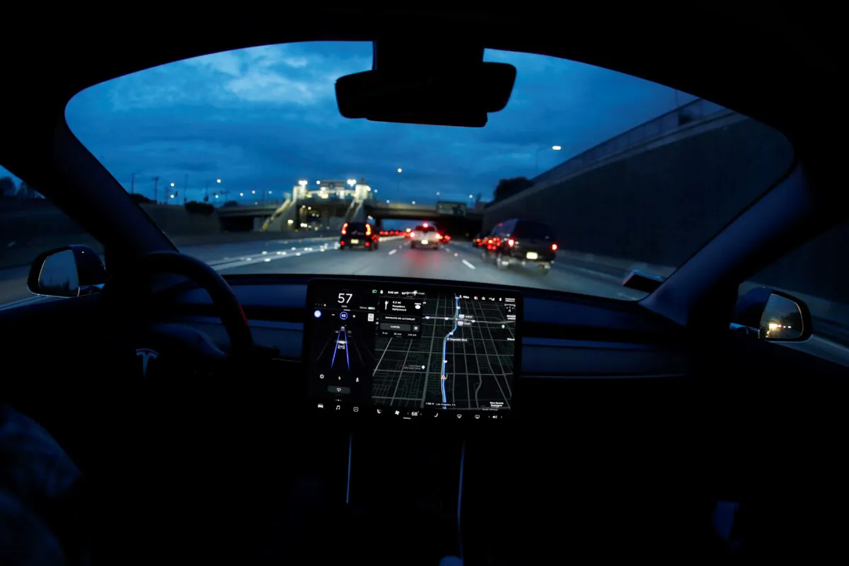 A Model 3 Tesla vehicle navigates morning rush hour using the car's auto pilot feature in Los Angeles on March 20, 2019. (Mike Blake/Reuters)