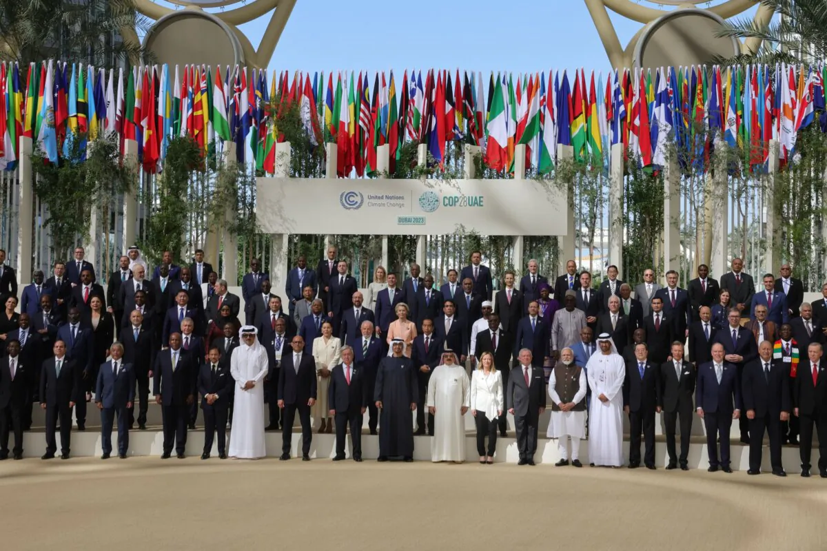 Participating world leaders and delegates pose for a photo during the COP28 U.N. climate summit in Dubai, United Arab Emirates, on Dec. 1, 2023. (Giuseppe Cacace/AFP via Getty Images)