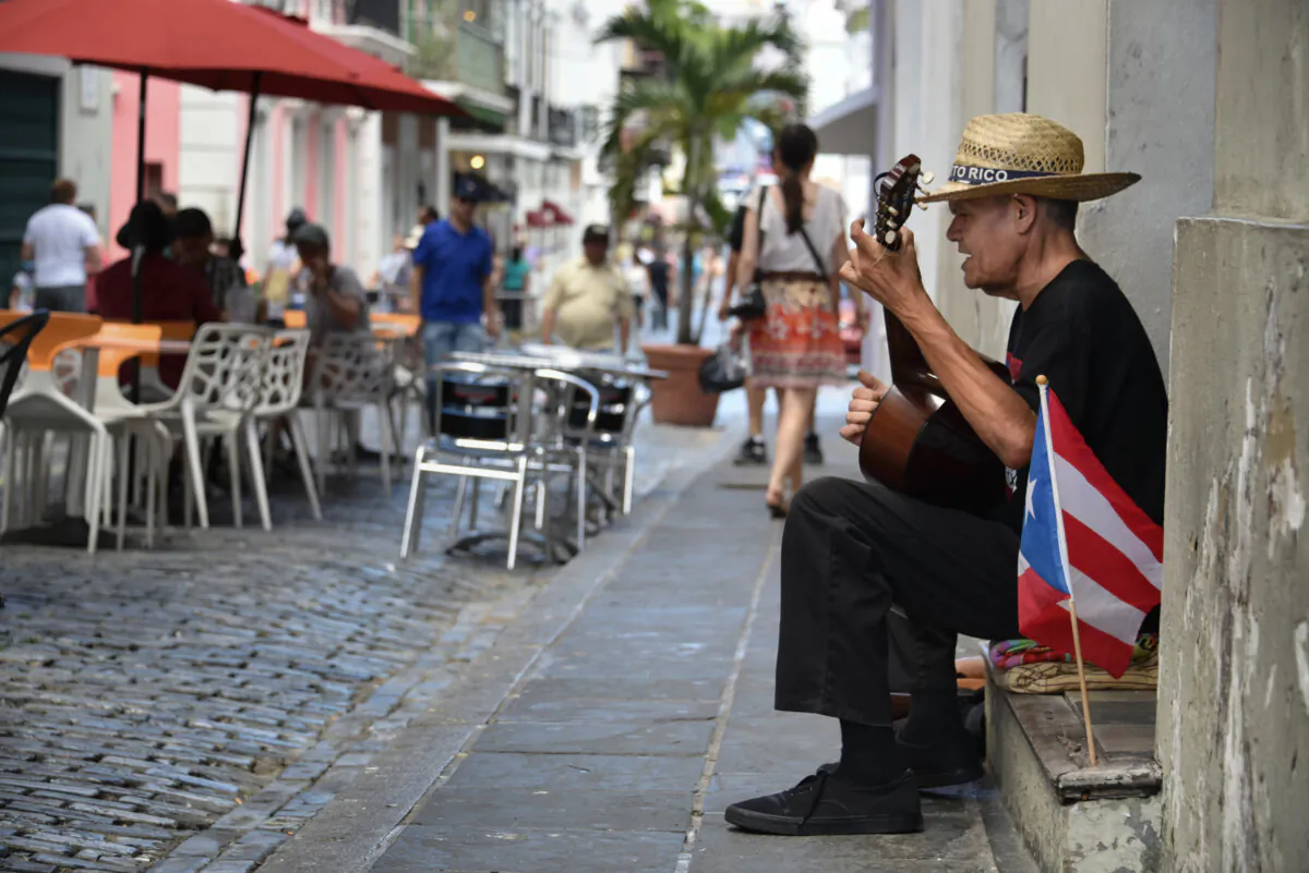 A street performer serenades diners in San Juan, Puerto Rico. Puerto Rico has become one of the most exciting destination-dining scenes in the Caribbean. (Mihai Coman/Dreamstime/TNS)