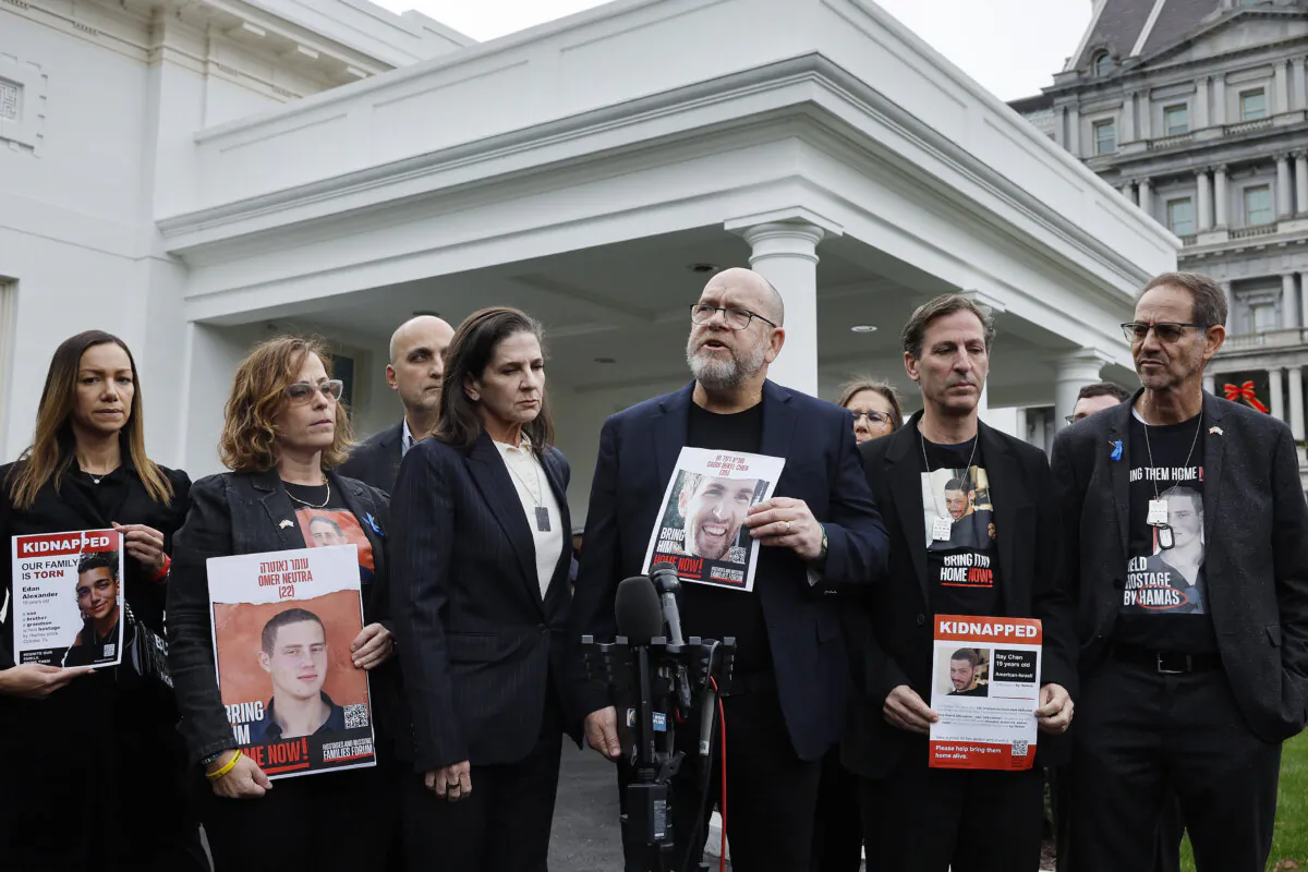 Family members of the Americans taken hostage by Hamas during the terrorist attacks in Israel on Oct. 7, including (R-L) Ronen Neutra, Ruby Chen, Jonathan Dekel-Chen, Liz Naftali, Adi Alexander, Orna Neutra, and Yael Alexander, talk to reporters outside the West Wing of the White House in Washington on Dec. 13, 2023. (Chip Somodevilla/Getty Images)