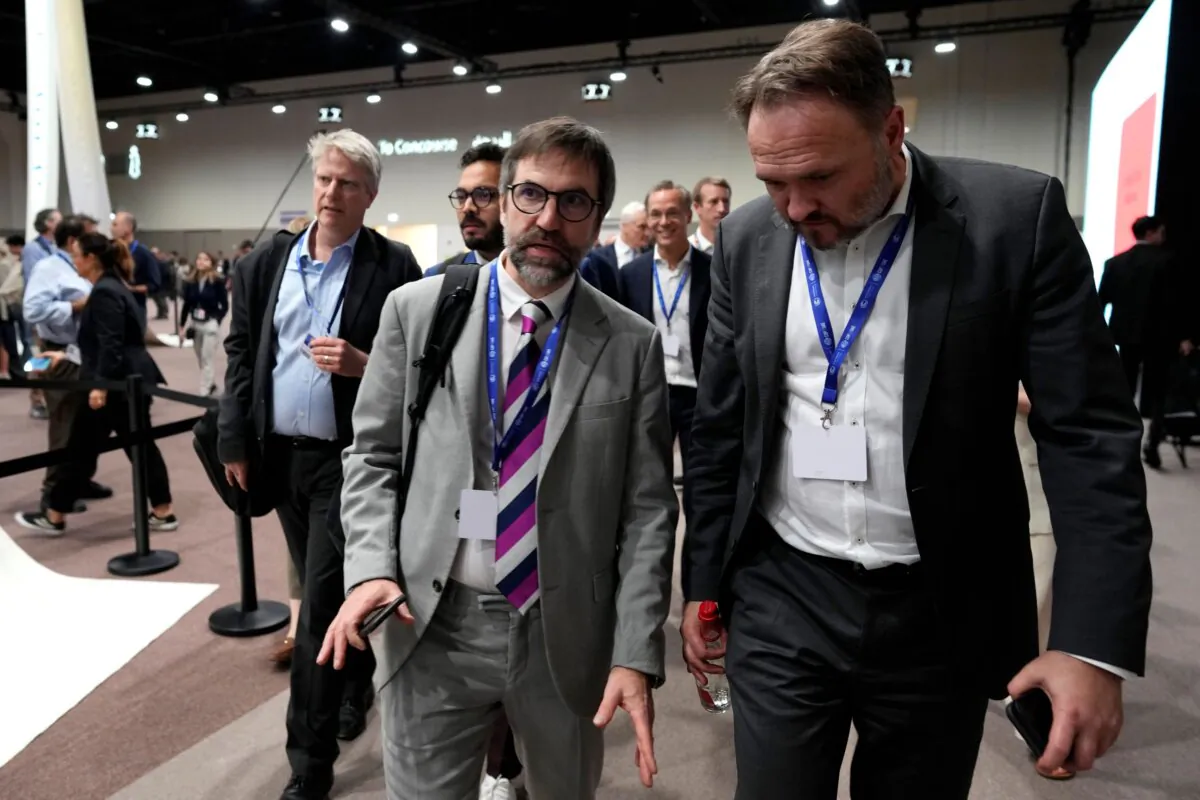 Environment Minister Steven Guilbeault (L) and Denmark's Minister for Climate Dan Jorgensen arrive at the COP28 summit in Dubai, United Arab Emirates, on Dec. 11, 2023. (AP Photo/Peter Dejong)