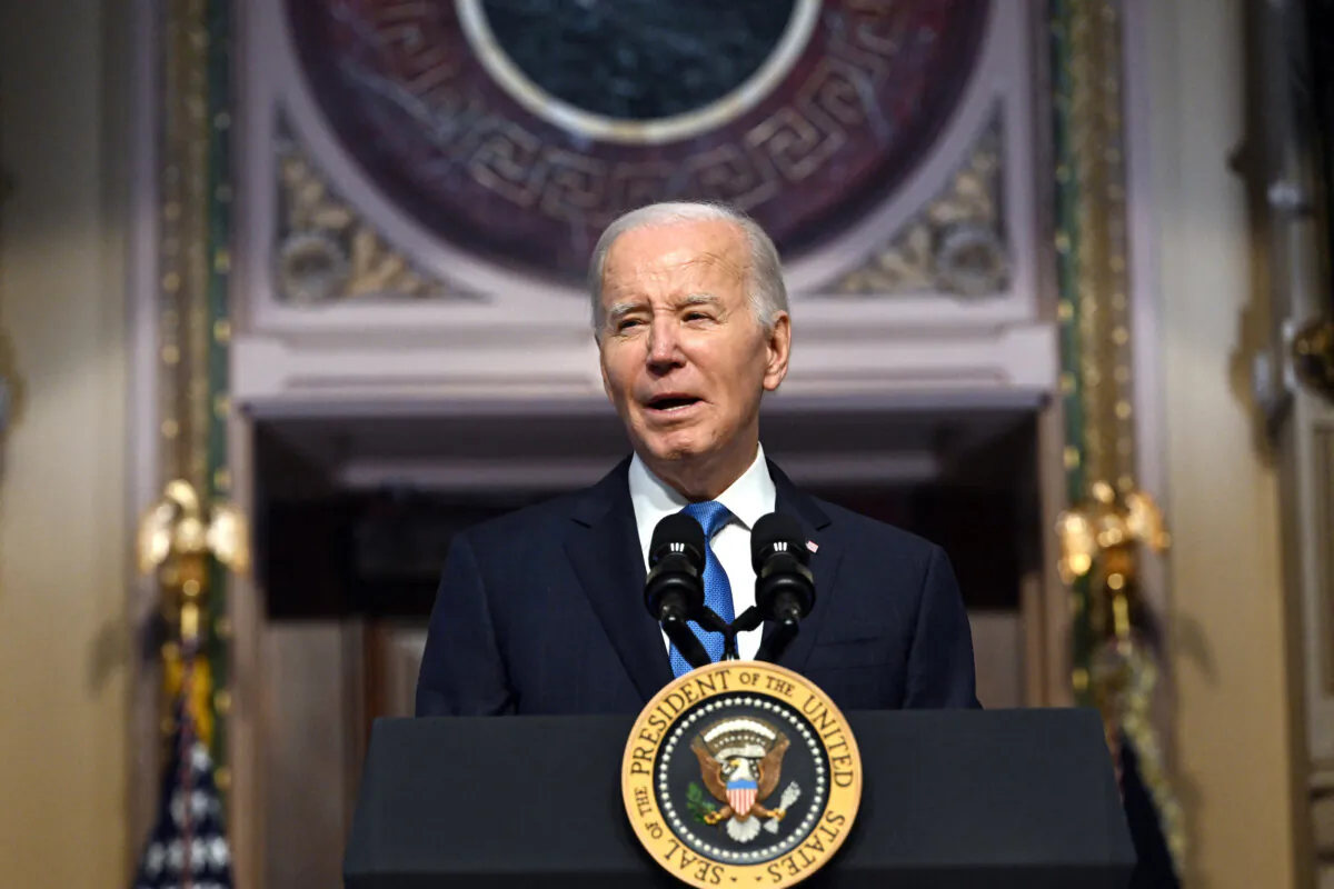 President Joe Biden speaks at a meeting of the National Infrastructure Advisory Council, in the Indian Treaty Room of the White House in Washington on Dec. 13, 2023. (Jim WATSON/AFP)