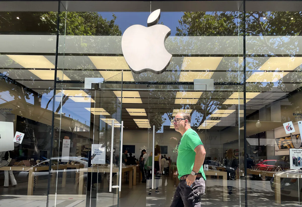 A pedestrian walks by an Apple Store in Berkeley, Calif., on Aug. 4, 2023. (Justin Sullivan/Getty Images)