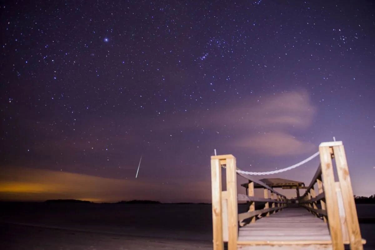 The Geminid meteor shower lights up the night sky above Tybee Island, Ga., on Dec. 14, 2017. (Will Peebles/Savannah Morning News via AP)