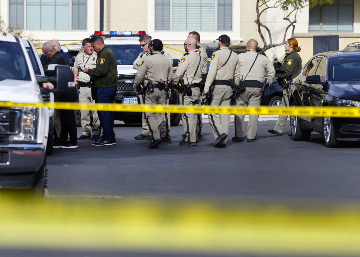 Las Vegas police investigate the scene of a shooting at a northwest valley apartment complex in Las Vegas on Dec. 11, 2023. (Bizuayehu Tesfaye/Las Vegas Review-Journal via AP)