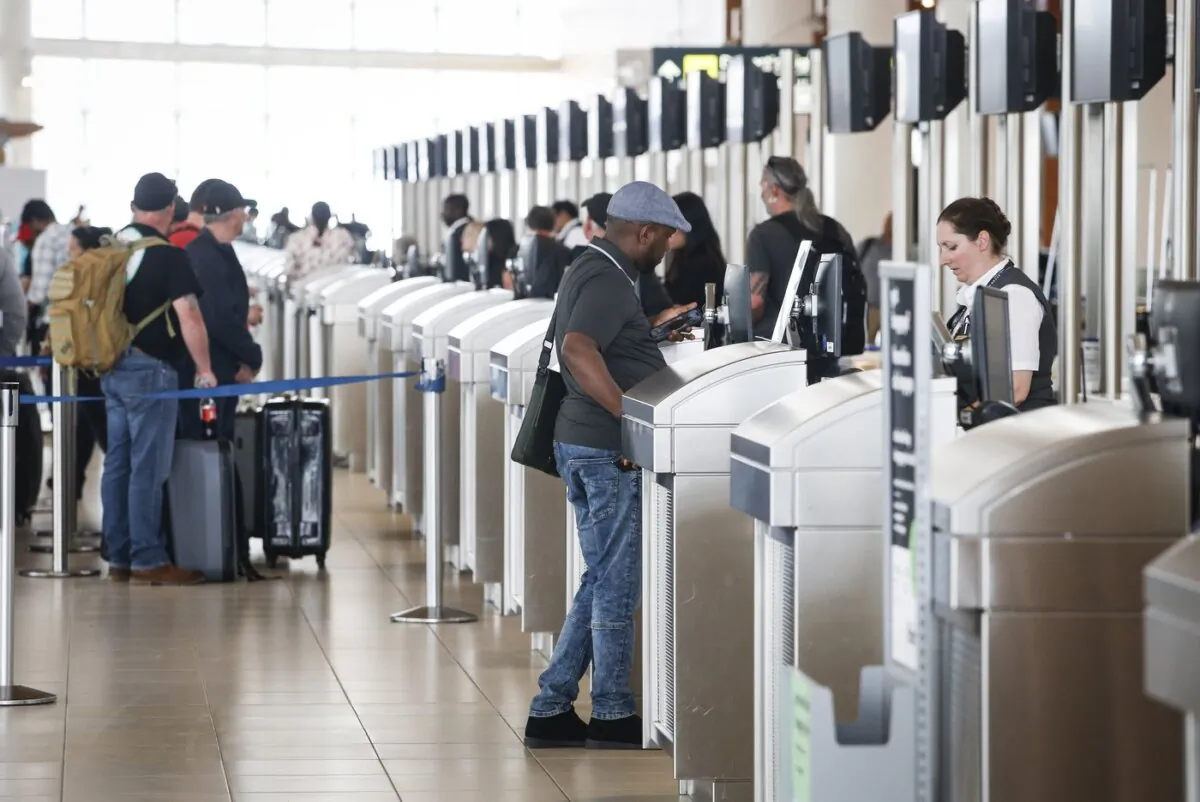 Passengers get checked in at Winnipeg airport, on June 6, 2023. (The Canadian Press/John Woods)