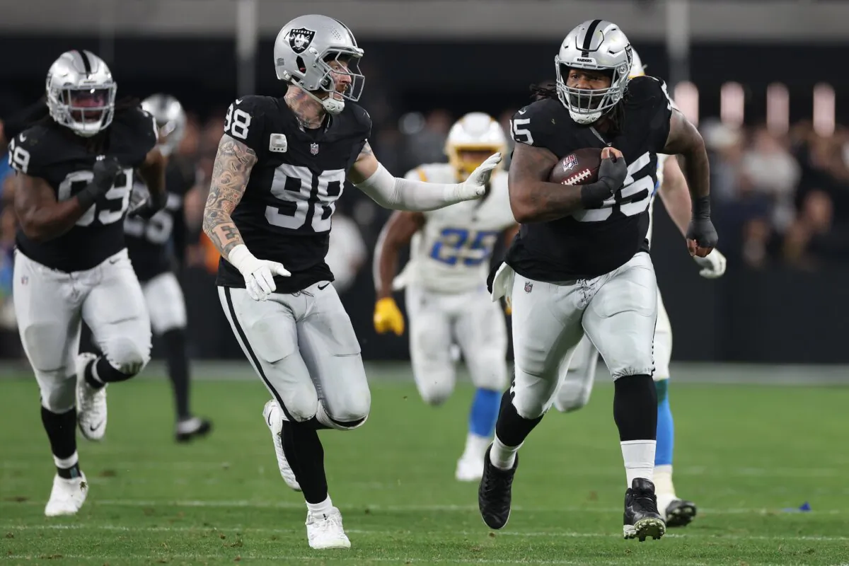 Defensive tackle John Jenkins (95) of the Las Vegas Raiders scores a touchdown against the Los Angeles Chargers during the third quarter in Las Vegas on Dec. 14, 2023. (Sean M. Haffey/Getty Images)
