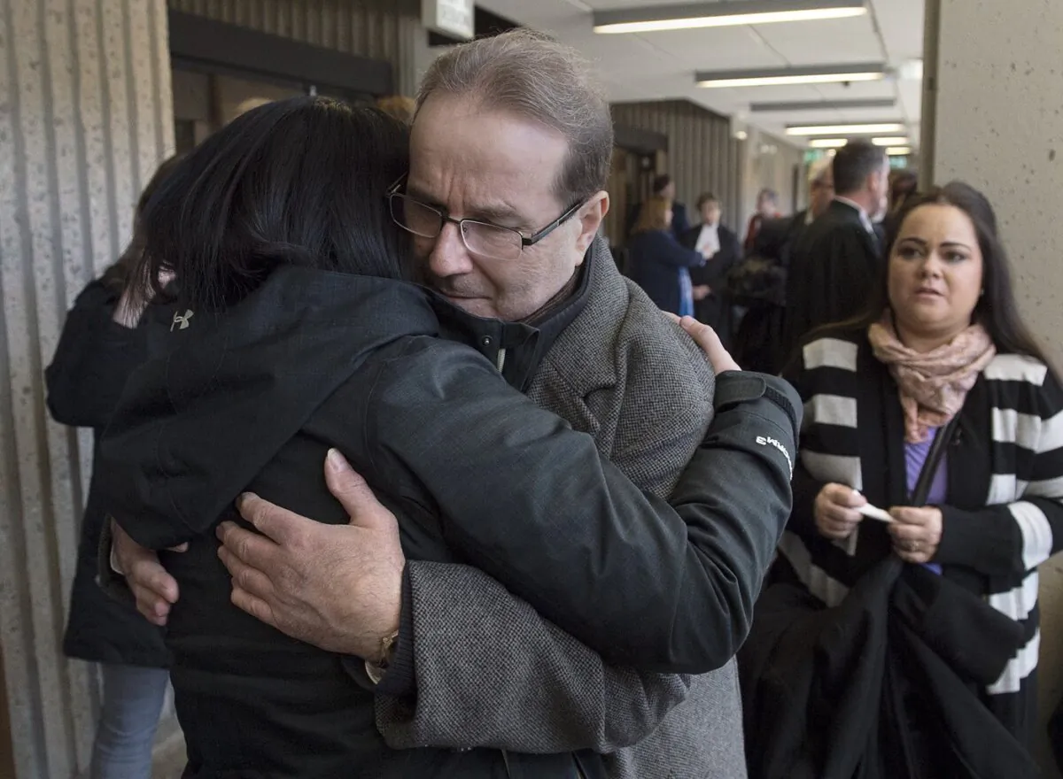 Glen Assoun is embraced by his daughter Amanda Huckle at Nova Scotia Supreme Court in Halifax on March 1, 2019. (The Canadian Press/Andrew Vaughan)