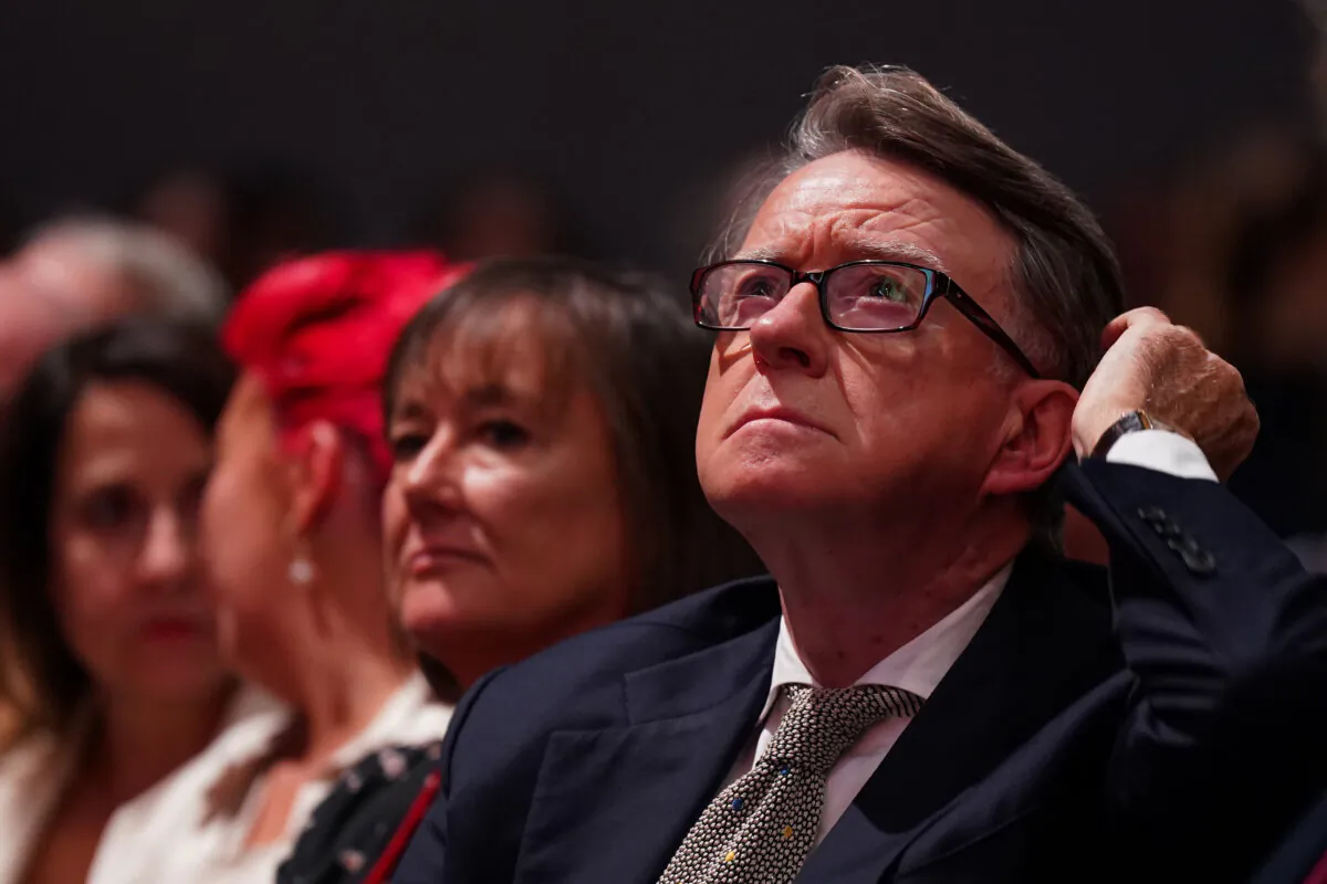 Lord Mandelson listens as Jonathan Reynolds, shadow secretary of state for business and trade, delivers his speech to delegates on day two of the Labour Party conference in Liverpool, England, on Oct. 9, 2023. (Ian Forsyth/Getty Images)