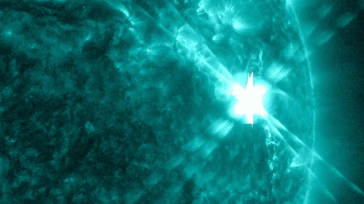 A solar flare as seen in the bright flash in the upper R on Dec. 14, 2023. (NASA via AP)
