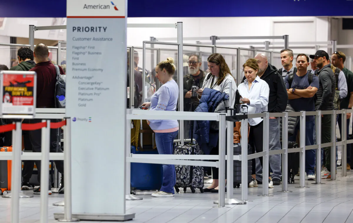Passengers wait in line at a TSA security checkpoint inside Terminal C at DFW International Airport on March 1, 2023, in Dallas. (Elias Valverde II/The Dallas Morning News/TNS)