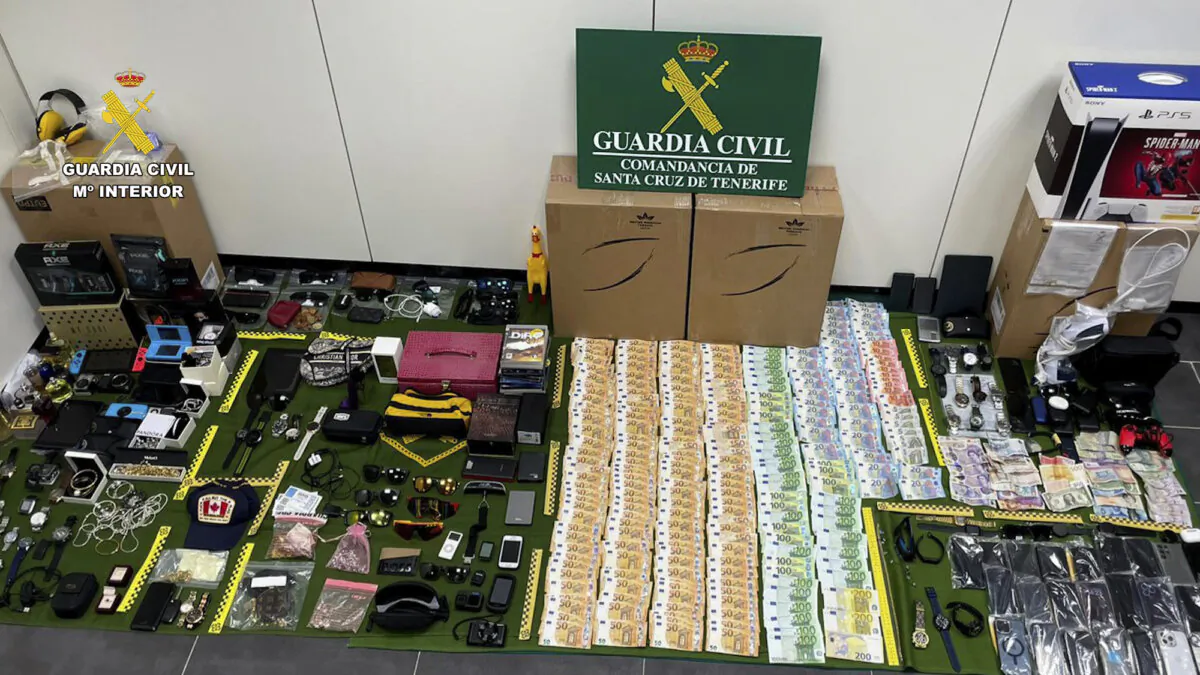 Items stolen from suitcases are displayed on the Canary island of Tenerife, Spain, in a photo provided on Dec. 15, 2023. (Guardia Civil via AP)