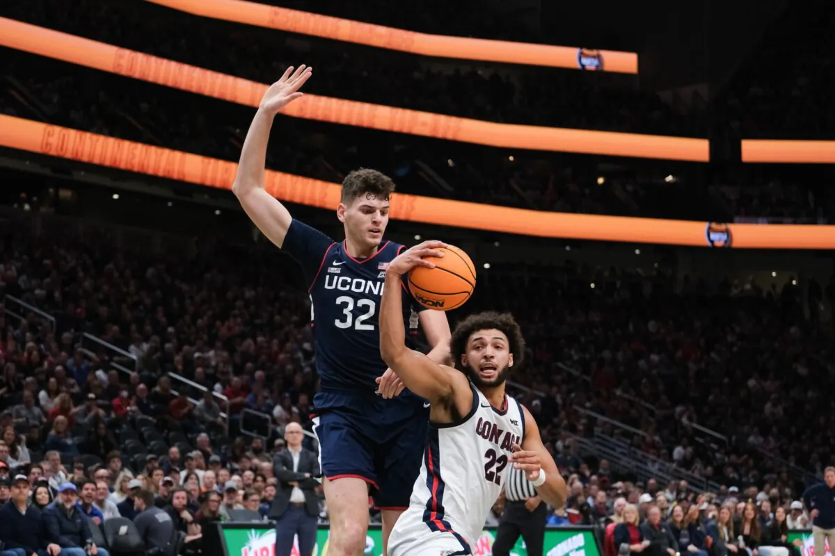 Anton Watson (22) of the Gonzaga Bulldogs fakes Donovan Clingan (32) of the Connecticut Huskies during the Continental Tire Seattle Tip-Off in Seattle on Dec. 15, 2023. (Conor Courtney/Getty Images)