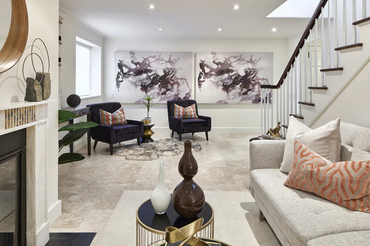 A pair of side chairs are angled in order to show spaciousness in a lower-level living space. (Handout/TNS)