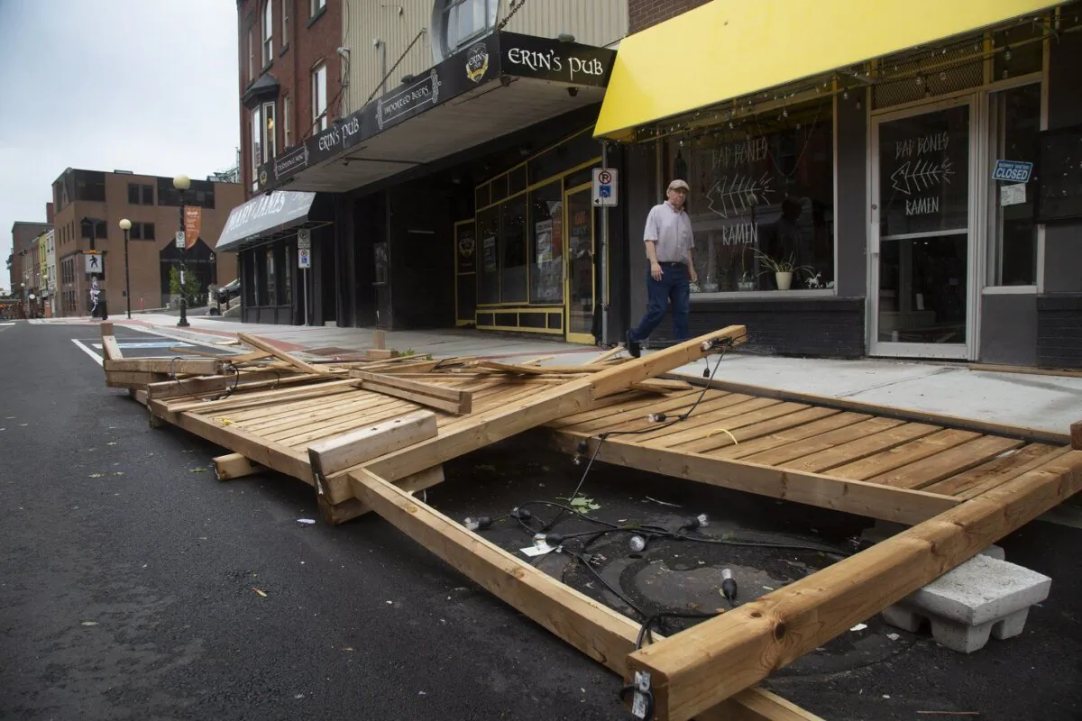 An outdoor seating area of Erin's Pub on Water Street was demolished after Hurricane Larry crossed over Newfoundland's Avalon Peninsula in the early morning hours, in St. John's, on Sept. 11, 2021. (The Canadian Press/Paul Daly)