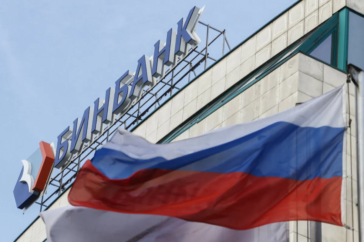 A Russian flag flies next to the headquarters of B&N Bank in downtown Moscow on Sept. 21, 2017. (Maxim Zmeyev/AFP via Getty Images)