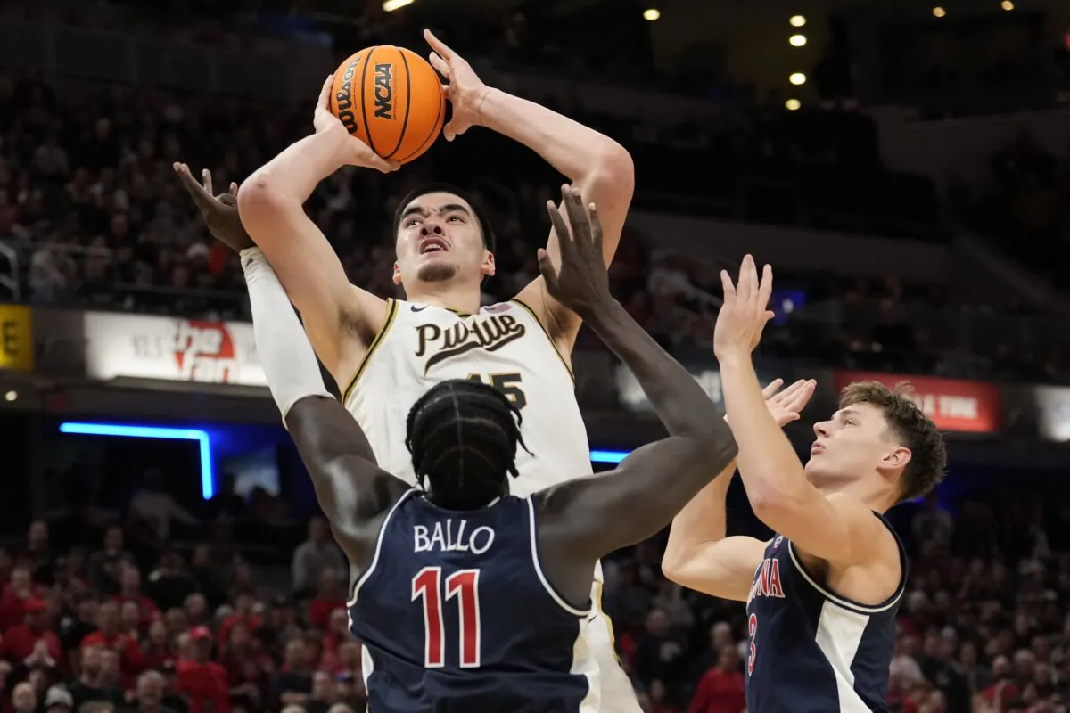 Purdue center Zach Edey (15) shoots over Arizona center Oumar Ballo (11) in the second half of an NCAA college basketball game in Indianapolis on Dec. 16, 2023. (AJ Mast/AP Photo)