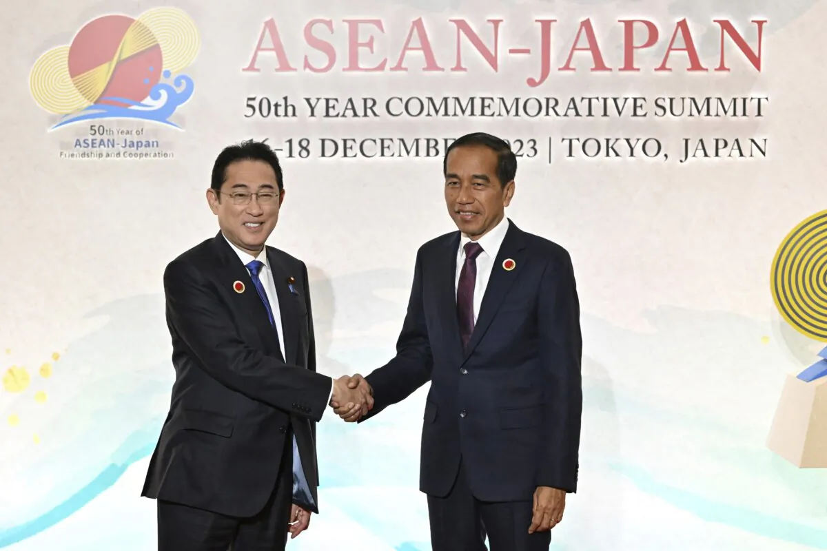 Japan's Prime Minister Fumio Kishida (L) greets Indonesia's President Joko Widodo upon arrival for the opening session of ASEAN-Japan Commemorative Summit Meeting at the Hotel Okura Tokyo in Tokyo on Dec. 17, 2023. (Kazuhiro Nogi/Pool Photo via AP)