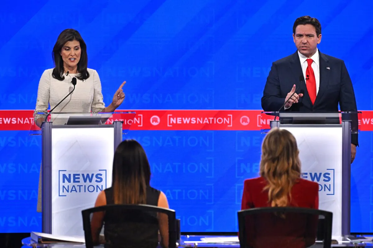 Florida Gov. Ron DeSantis (R) and former South Carolina governor  and U.N. Ambassador Nikki Haley gesture as they speak during the fourth Republican presidential primary debate at the University of Alabama in Tuscaloosa, on Dec. 6, 2023. (Jim Watson/AFP via Getty Images)