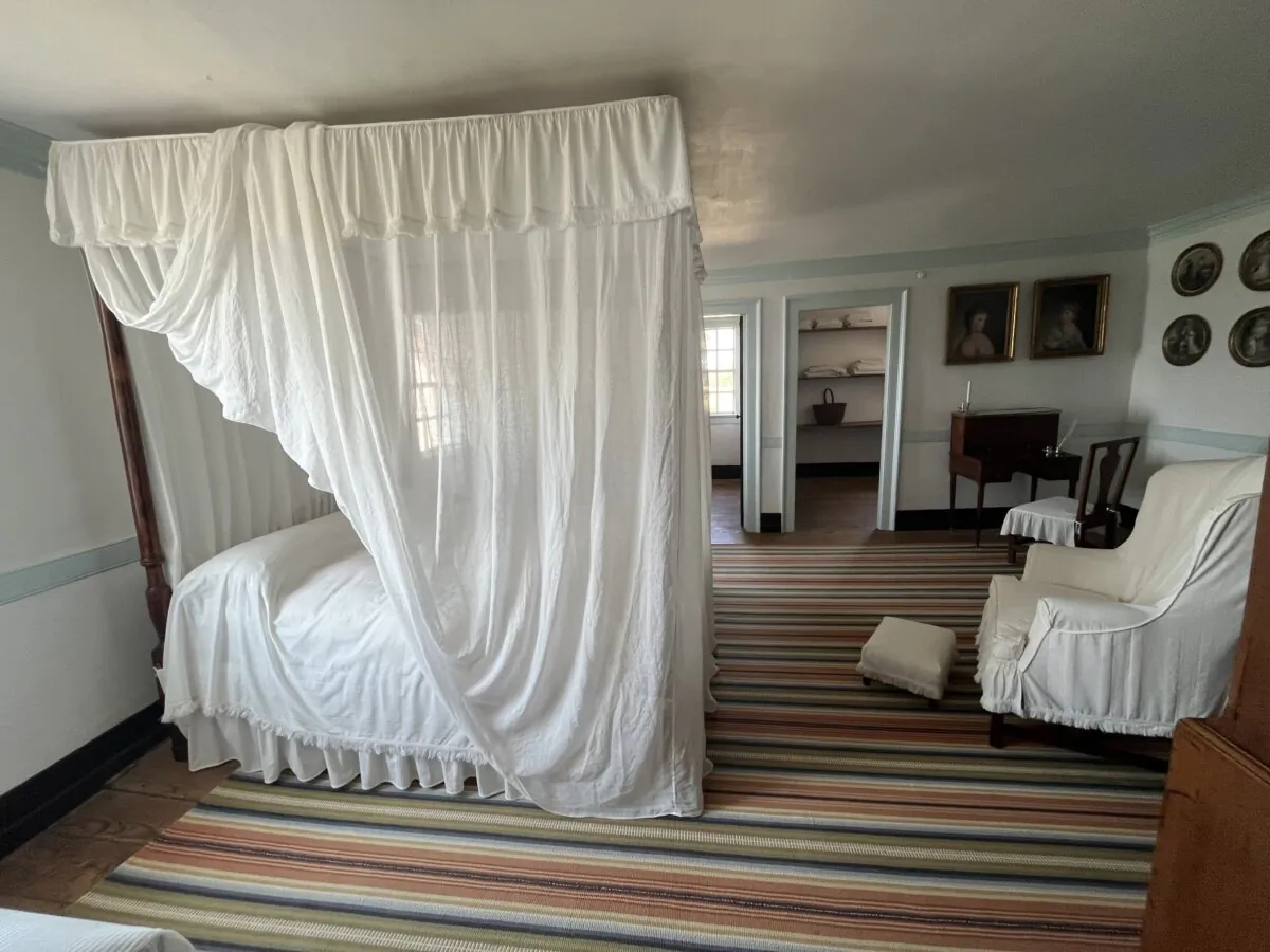 George and Martha Washington enjoyed simple elegance in their bed chambers, and preferred white linens. Purchased in the early 1790s, the four-poster, canopy bed is just over six feet, six inches long to accommodate Washington’s more than six-foot height. It is the bed in which he died in 1799. The French writing desk crafted of mahogany with a marble top and brass fittings was regularly used by Martha. (Courtesy of the Mount Vernon Ladies' Association of the Union)