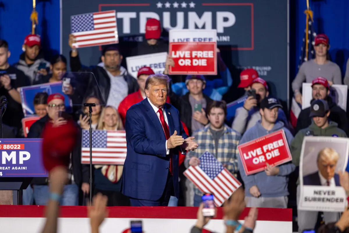 Republican presidential candidate, former President Donald Trump claps during a campaign event at the Whittemore Center Arena in Durham, N.H., on Dec. 16, 2023. (Scott Eisen/Getty Images)