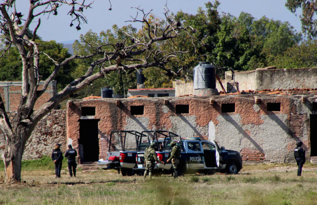 Authorities work at the scene where members of an armed group opened fire to partygoers attending a posada, in Salvatierra, in Guanajuato state, Mexico, on Dec. 17, 2023. (Juan Moreno/Reuters)